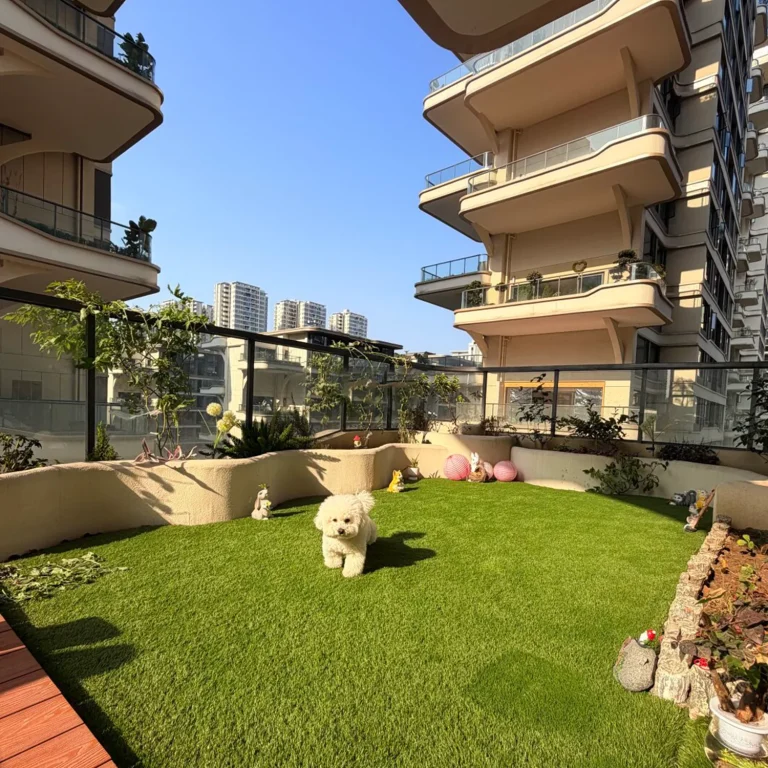 Artificial grass terrace beside a residential building