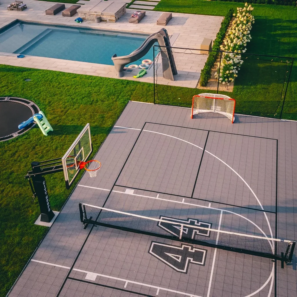 Private multi-use court beside a residential garden