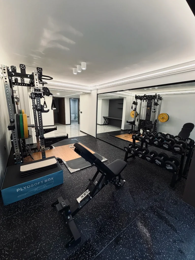 Rubber-tiled training area with free weights
