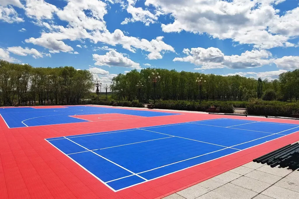 Outdoor court with blue playing area and red perimeter