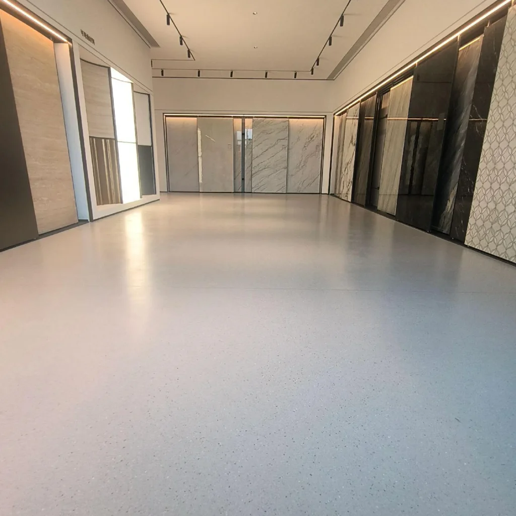 Light-coloured sheet flooring in a material showroom